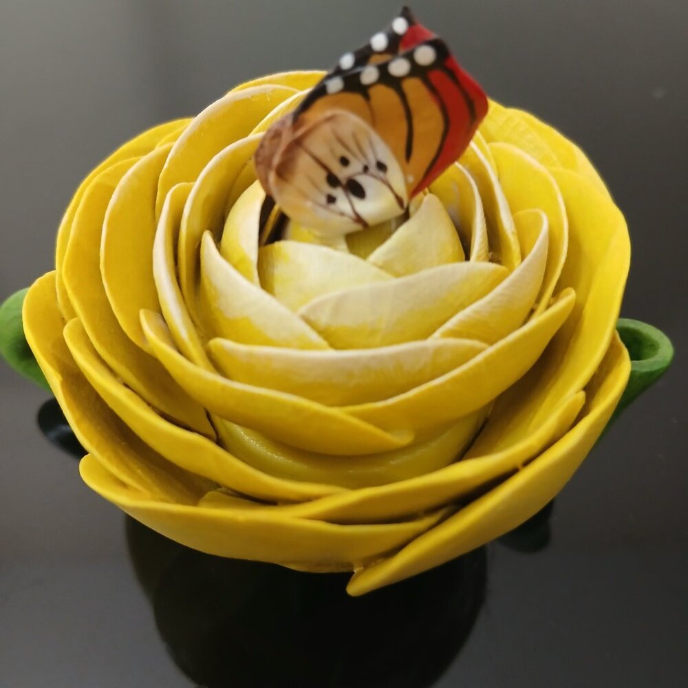 A yellow mini tea pot.